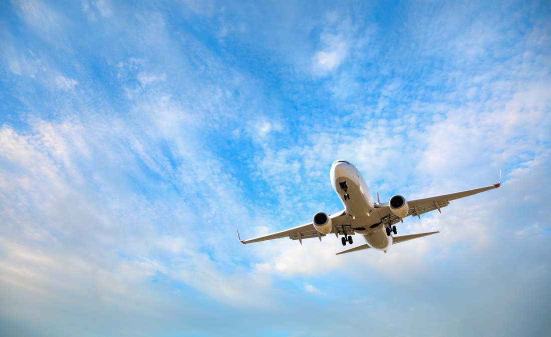 Airplane in the sky above Newark Airport