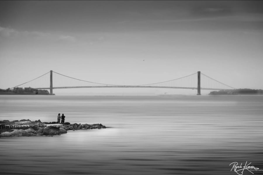 Liberty State Park at dusk with the Verrazano Bridge in the background.