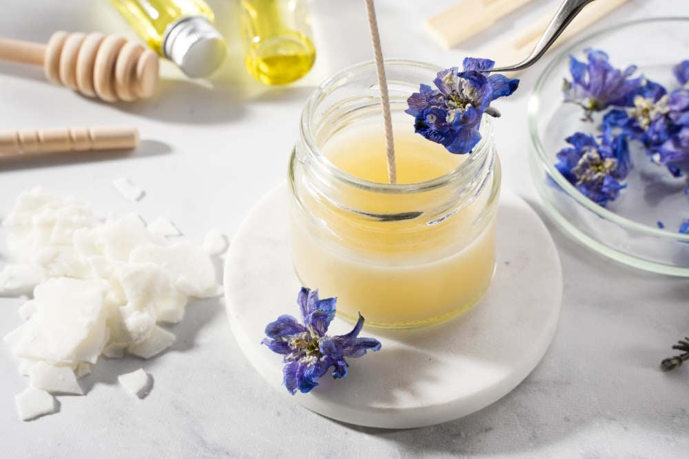 Set tools for homemade natural eco-friendly soy wax candles, wicks, perfume, essential oil on a marble table